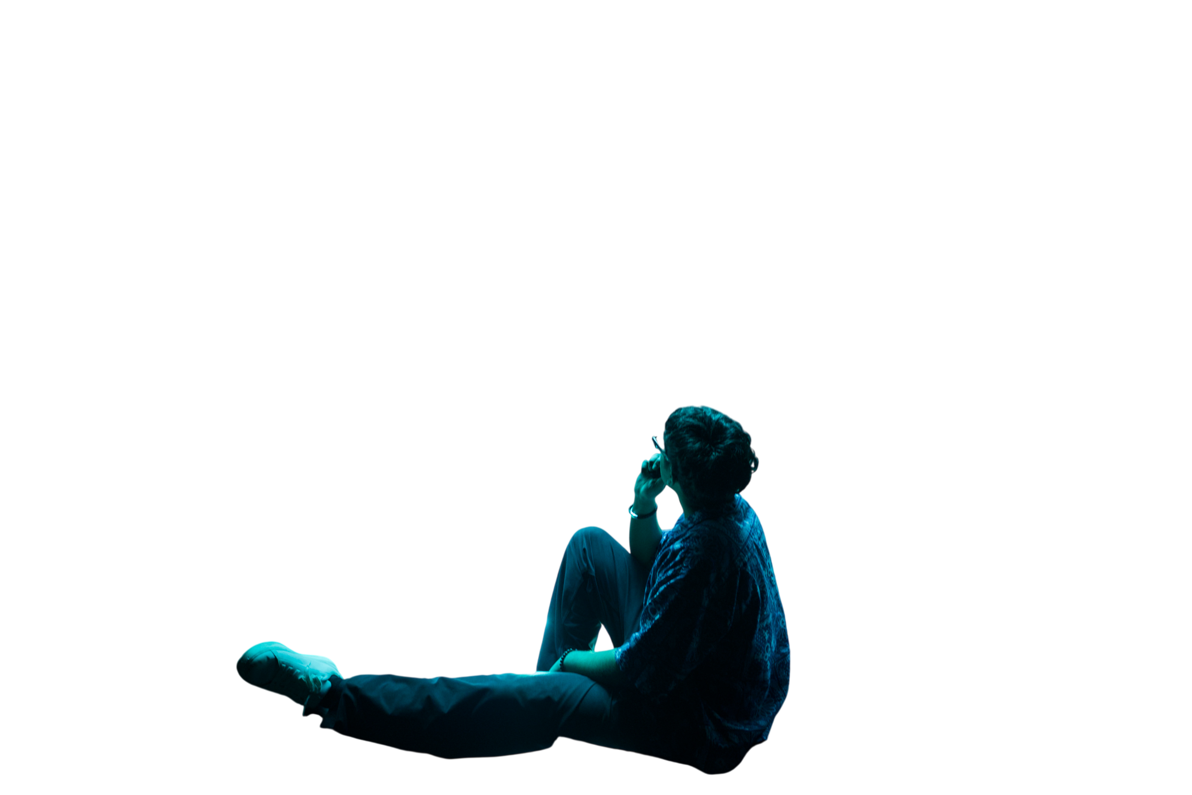 Shelain seated in profile, looking upward